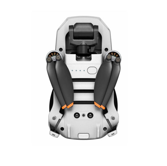 Bottom view of the DJI Mini 2 SE drone, showing its compact design and folded propellers.