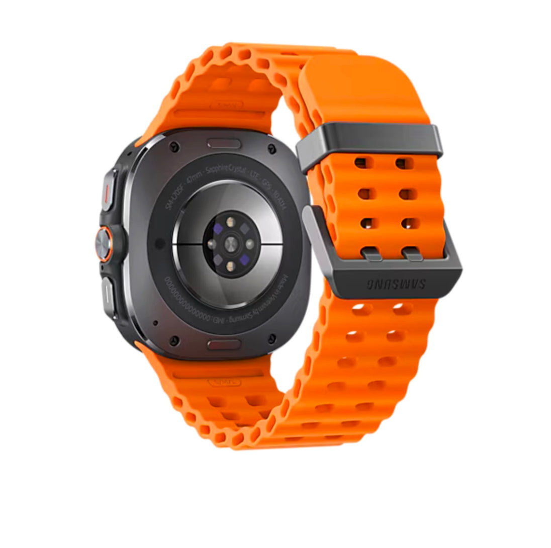 Back view of the Samsung Galaxy Watch Ultra with an orange band, highlighting the heart rate sensor and the robust build.